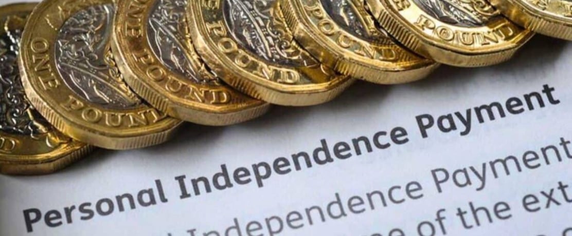 Stacked-1-coins-on-a-personal-independence-payment-PIPpaper-1200x727