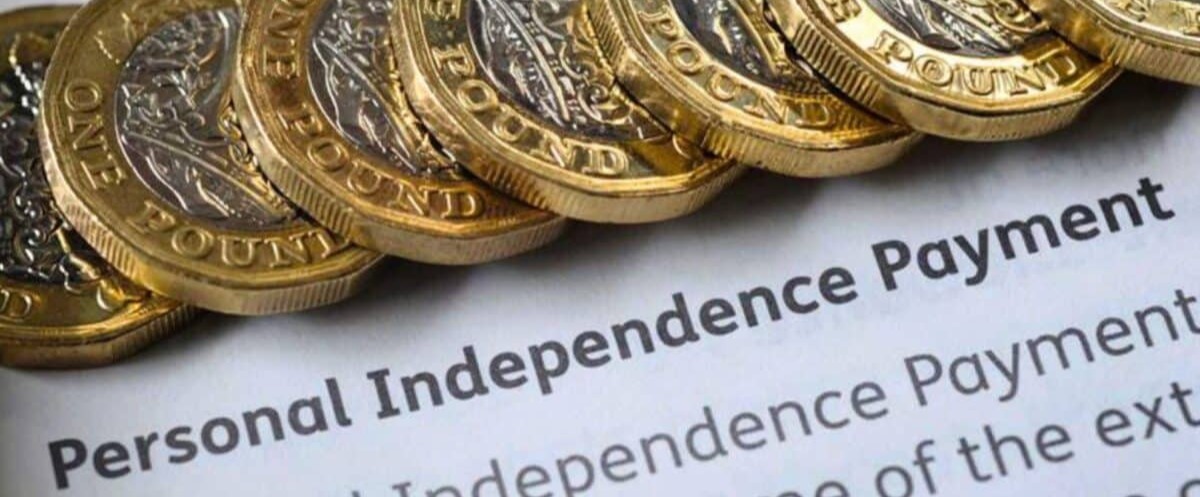 Stacked-1-coins-on-a-personal-independence-payment-PIPpaper-1200x727